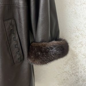 Like new mink and leather 3/4 coat. Genuine Choc brown leather with mink inside